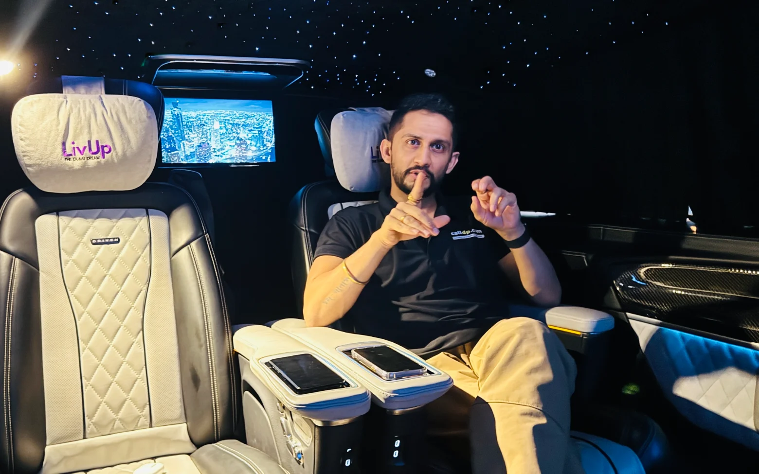 Digital Pratik talking with his hands while explaining something, sitting at a desk