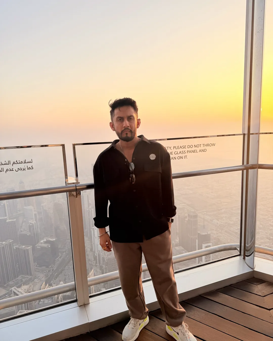 Digital Pratik on a high deck in Dubai at sunset