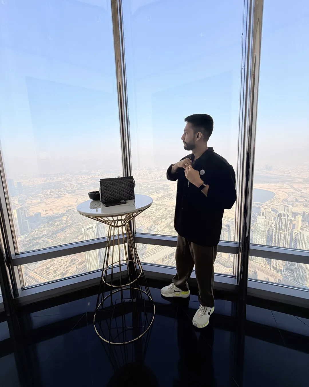 Digital Pratik looking out over Dubai from a high window