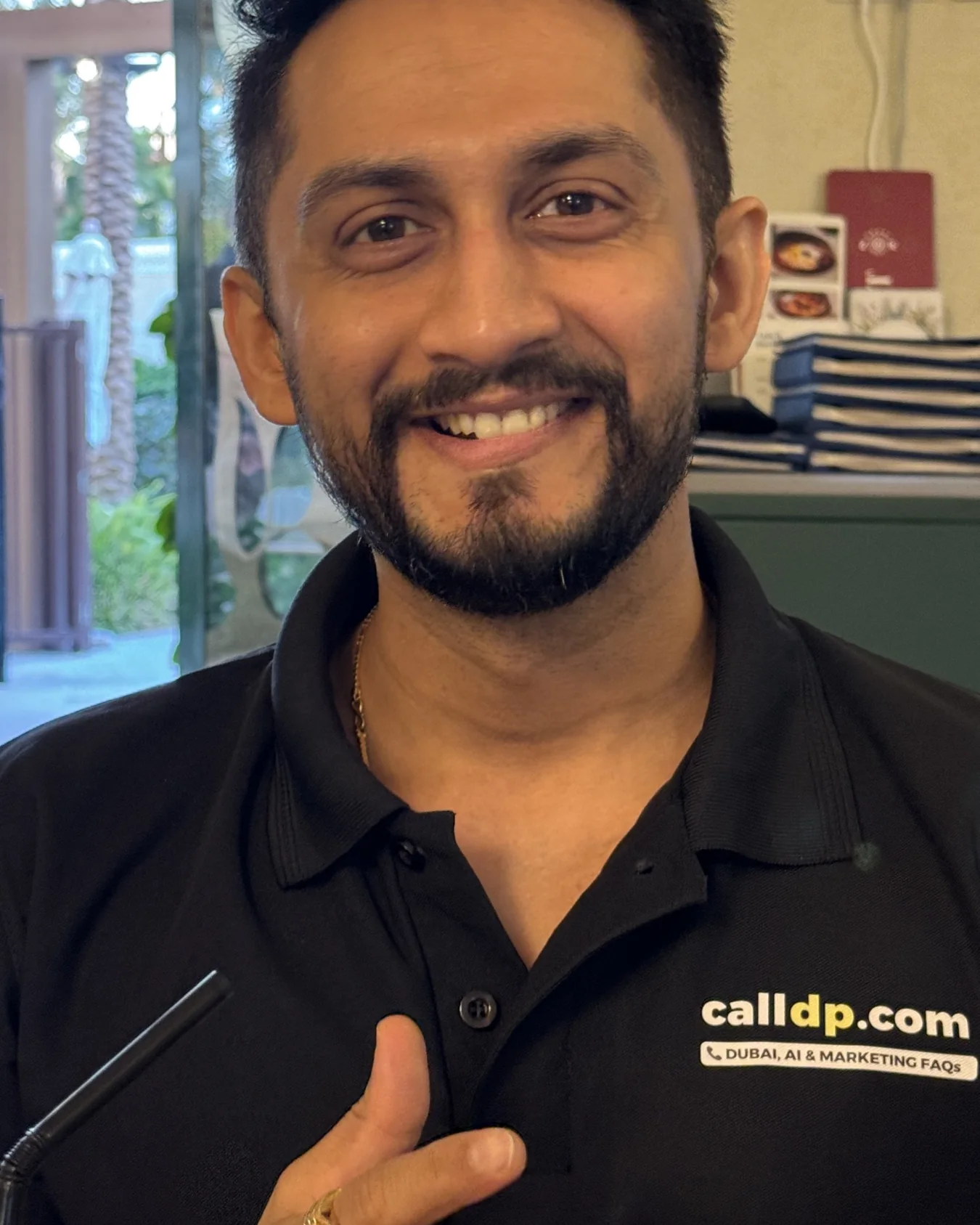 Digital Pratik smiling in a calldp.com polo shirt