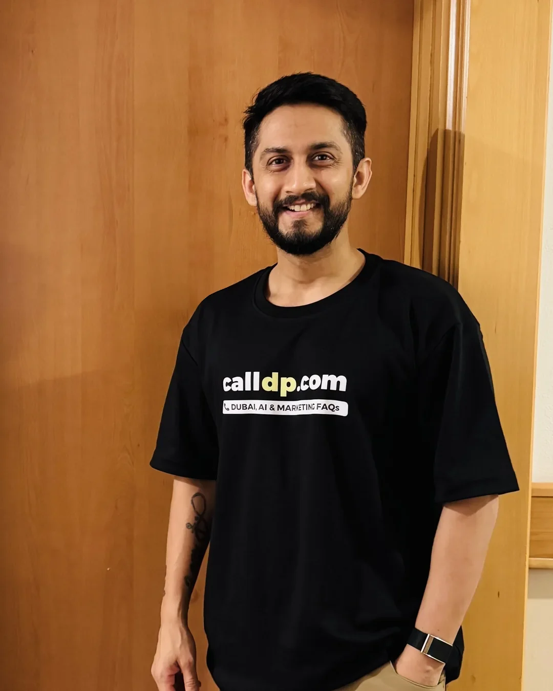 Digital Pratik smiling in a calldp.com t-shirt