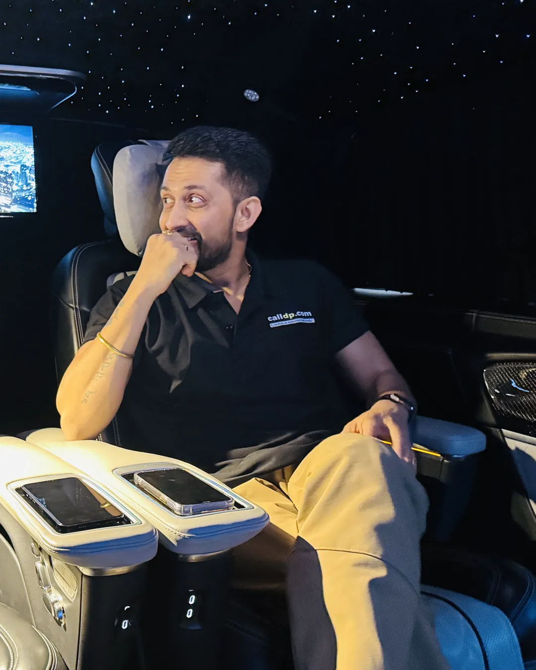 Digital Pratik thinking, seated in a car at night