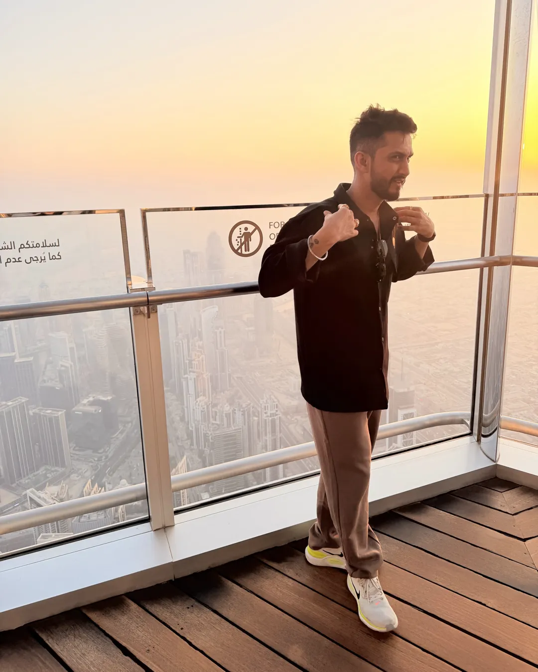 Digital Pratik on a high deck in Dubai at sunset
